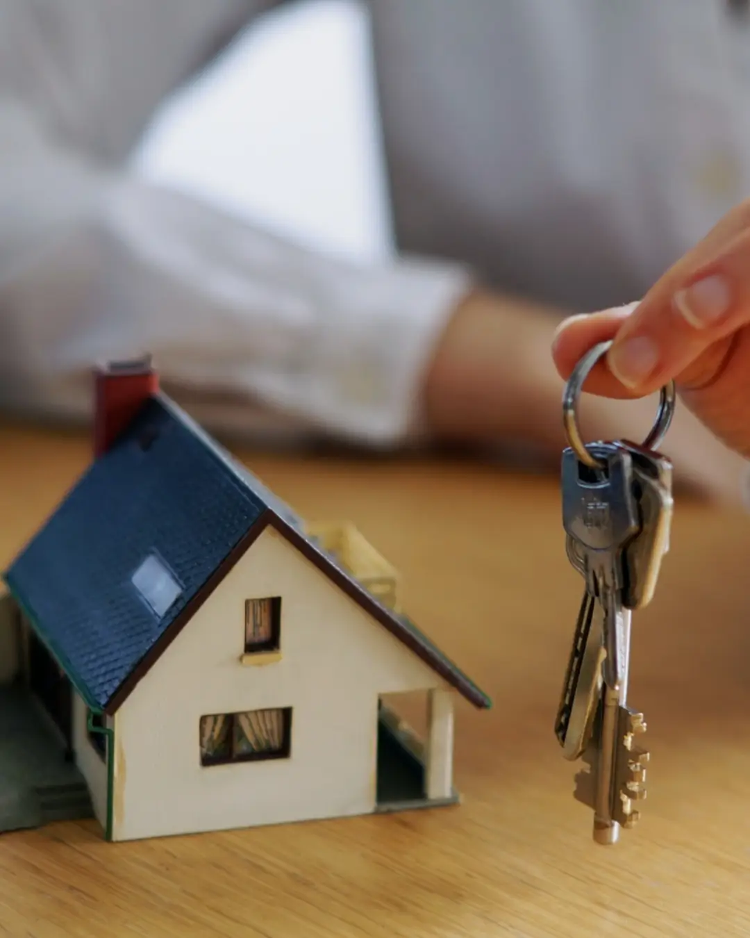 Closeup shot of a person thinking of buying or selling a house